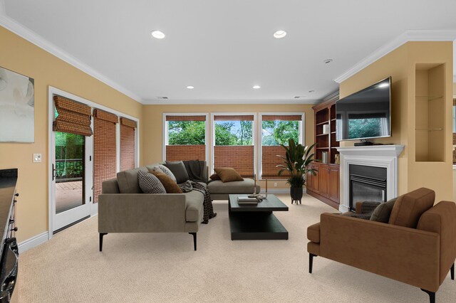 1431 Edgemoor Ave, Kalamazoo, MI 49008 - living area with light colored carpet, crown molding, recessed lighting, and a glass covered fireplace