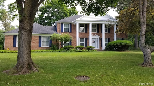 5396 Provincial Dr, Bloomfield Hills, MI 48302 - neoclassical home with brick siding, a front lawn, and a shingled roof