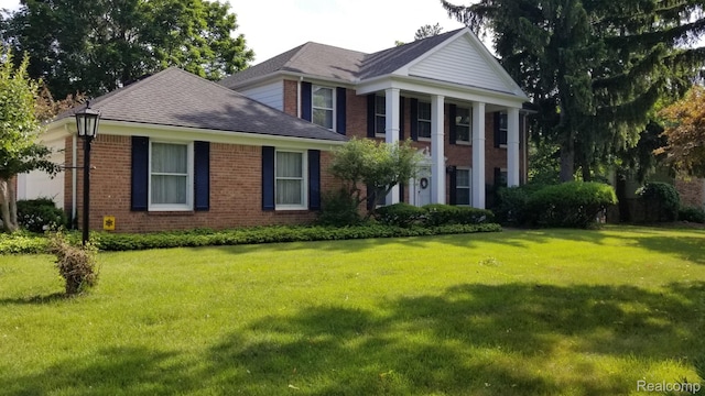 5396 Provincial Dr, Bloomfield Hills, MI 48302 - neoclassical home featuring brick siding, a front lawn, and roof with shingles