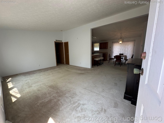 8049 Mckinley Rd, Clay, MI 48001 - living room with light colored carpet and a textured ceiling