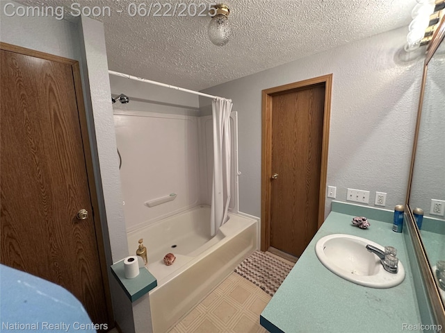 8049 Mckinley Rd, Clay, MI 48001 - full bath featuring shower / tub combo, vanity, tile patterned floors, and a textured ceiling