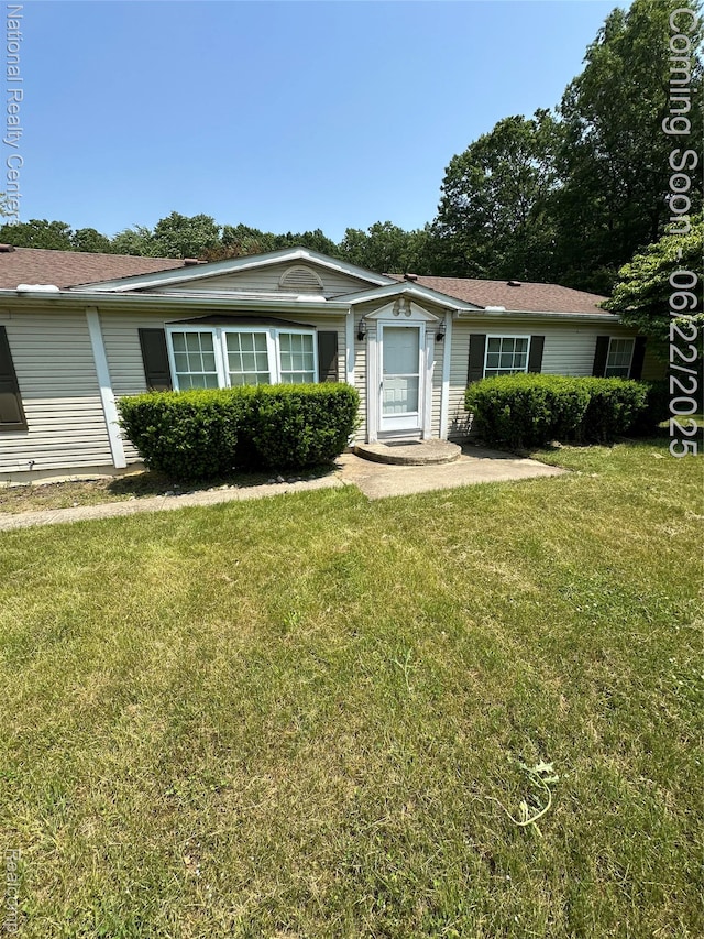 8049 Mckinley Rd, Clay, MI 48001 - view of front facade with a front lawn