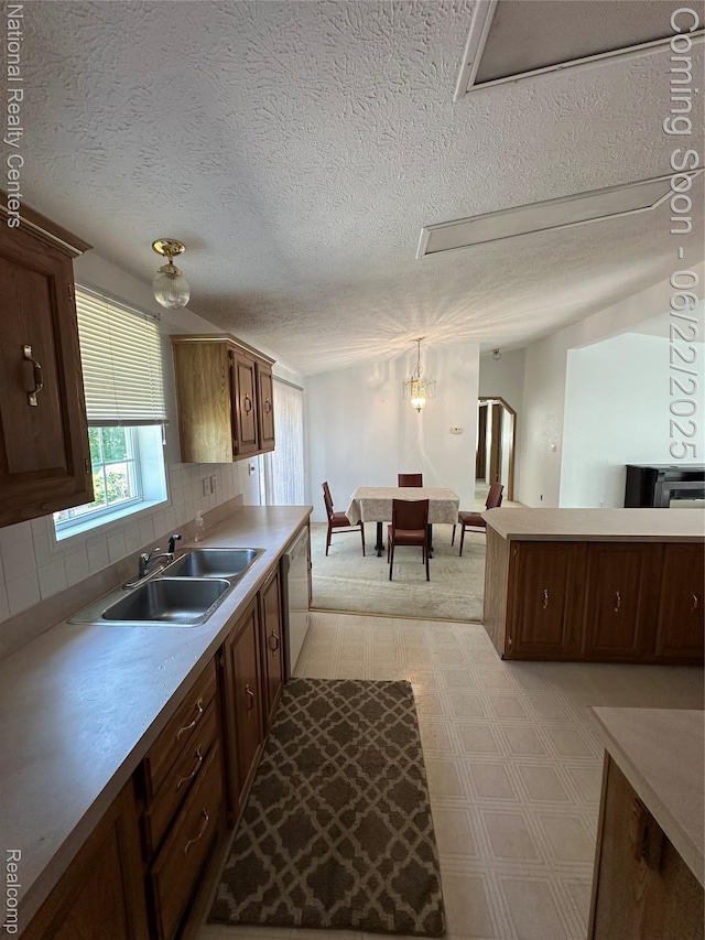 8049 Mckinley Rd, Clay, MI 48001 - kitchen with light flooring, backsplash, light countertops, and a textured ceiling