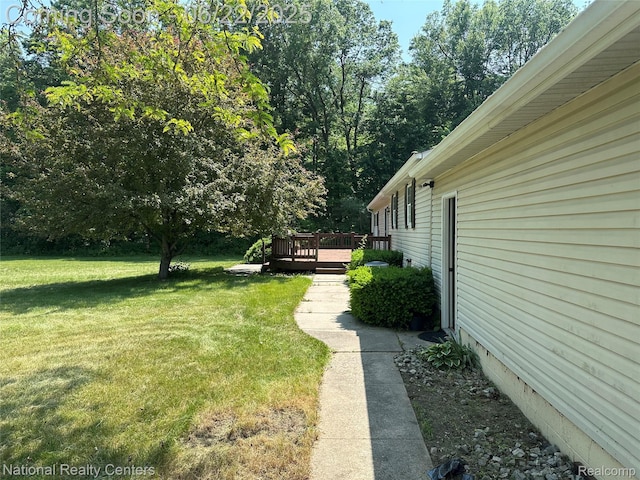 8049 Mckinley Rd, Clay, MI 48001 - view of green lawn featuring a wooden deck