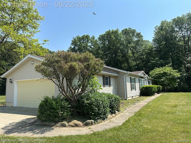 8049 Mckinley Rd, Clay, MI 48001 - view of home's exterior featuring a lawn and driveway