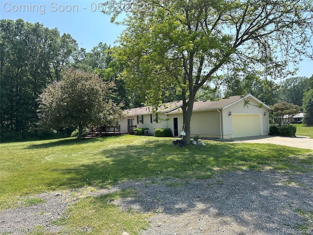 8049 Mckinley Rd, Clay, MI 48001 - view of front facade featuring concrete driveway, an attached garage, and a front lawn