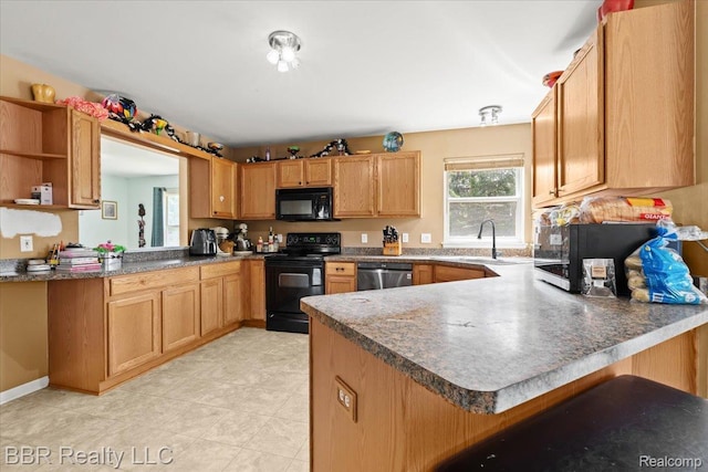 20077 Dovetail Dr, Brownstown, MI 48183 - kitchen featuring a peninsula, black appliances, and open shelves