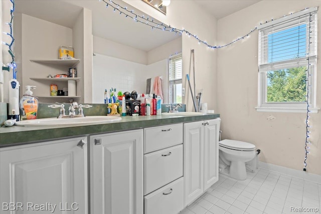 20077 Dovetail Dr, Brownstown, MI 48183 - full bathroom with double vanity and tile patterned flooring