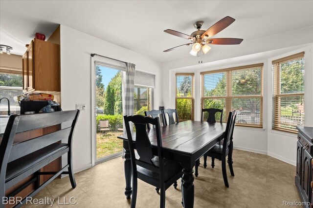 20077 Dovetail Dr, Brownstown, MI 48183 - dining space with plenty of natural light and ceiling fan