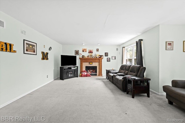 20077 Dovetail Dr, Brownstown, MI 48183 - living room featuring light colored carpet and a warm lit fireplace