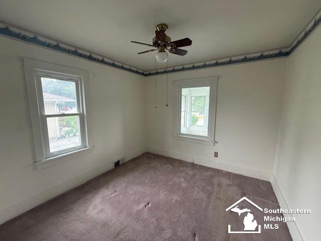 211 Huber Dr, Monroe, MI 48162 - empty room featuring healthy amount of natural light, carpet floors, and a ceiling fan