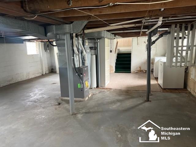 211 Huber Dr, Monroe, MI 48162 - basement with washer and clothes dryer and heating unit