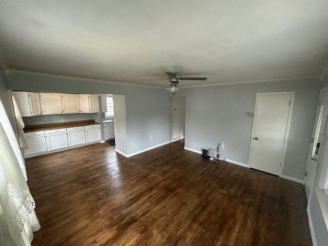 9262 Washington St, Romulus, MI 48174 - unfurnished living room with dark wood-style flooring, ceiling fan, and crown molding