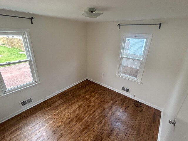 9262 Washington St, Romulus, MI 48174 - spare room featuring wood finished floors and baseboards