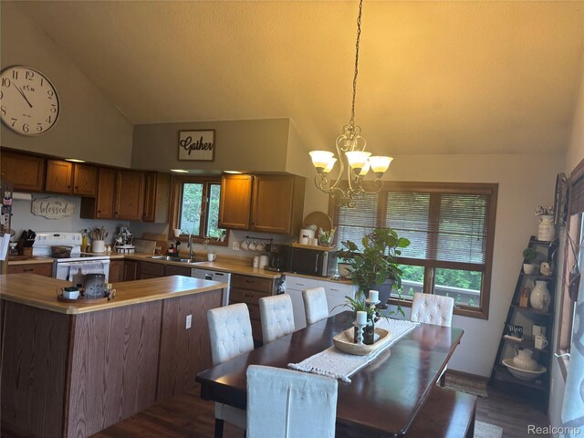 5636 Crescent St, Norway, MI 49870 - dining room featuring wood finished floors, high vaulted ceiling, and a chandelier