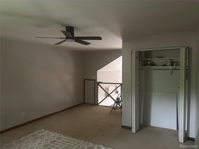5636 Crescent St, Norway, MI 49870 - unfurnished bedroom with carpet flooring, a closet, and a ceiling fan