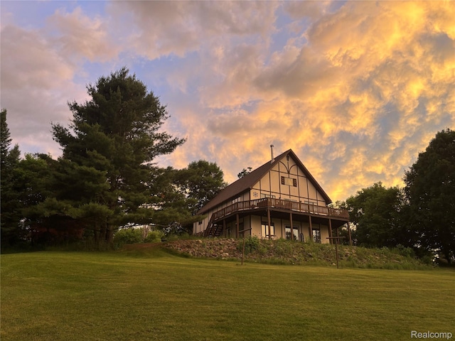 5636 Crescent St, Norway, MI 49870 - back of house featuring a wooden deck and a lawn
