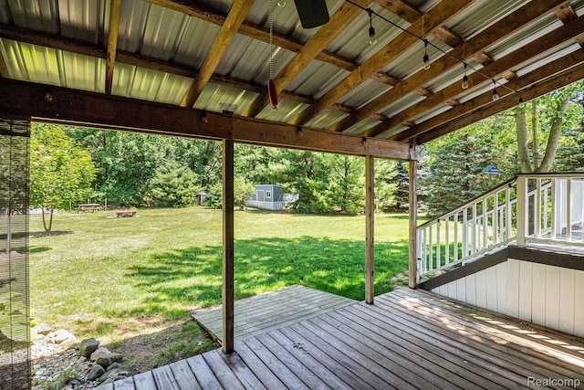 4788 Apache Trl, Columbiaville, MI 48421 - deck featuring a lawn and view of wooded area
