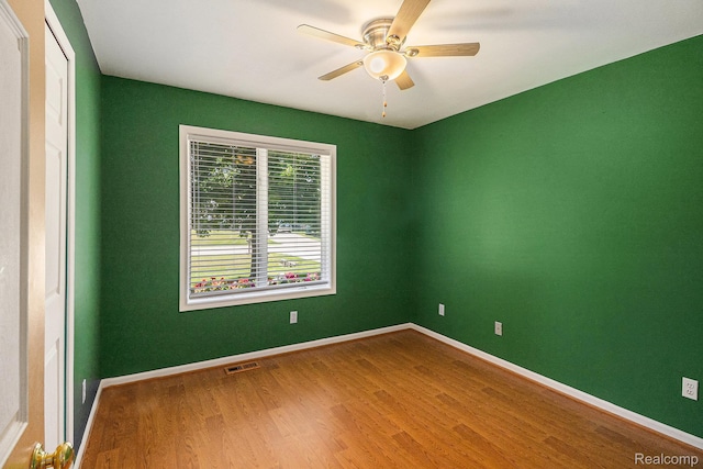 4788 Apache Trl, Columbiaville, MI 48421 - empty room with wood finished floors and ceiling fan