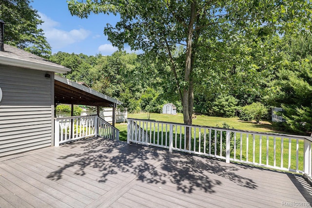 4788 Apache Trl, Columbiaville, MI 48421 - wooden deck featuring a storage shed and a yard