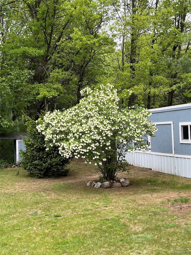 4788 Apache Trl, Columbiaville, MI 48421 - view of grassy yard with a shed