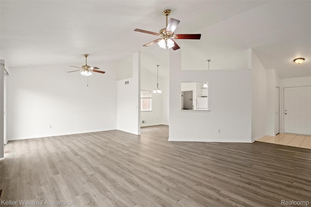 41215 Westfield Cir, Canton, MI 48188 - unfurnished living room with a ceiling fan, wood finished floors, and high vaulted ceiling