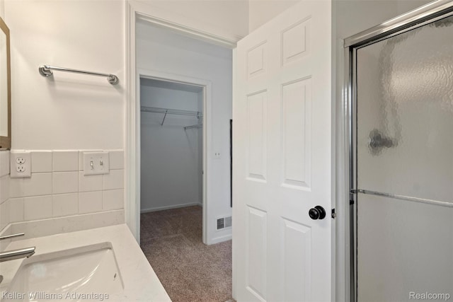 41215 Westfield Cir, Canton, MI 48188 - full bathroom featuring a shower stall, vanity, and a walk in closet