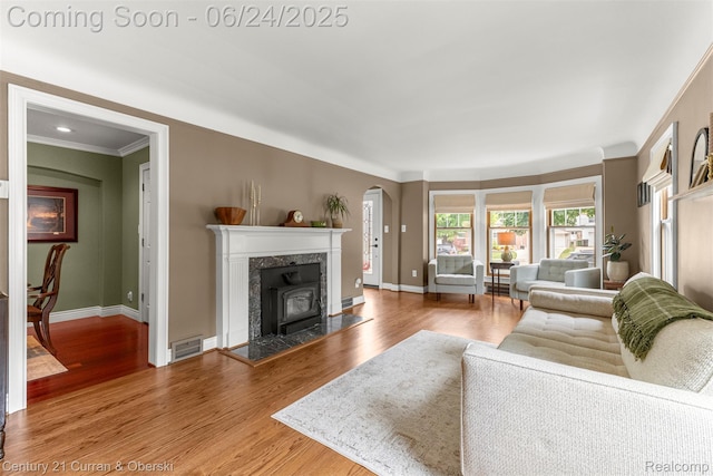 15275 Belmont Ave, Allen Park, MI 48101 - living area with arched walkways, wood finished floors, and ornamental molding