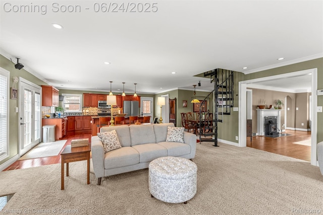 15275 Belmont Ave, Allen Park, MI 48101 - living area featuring crown molding, stairway, recessed lighting, and light colored carpet