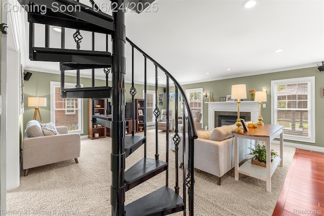 15275 Belmont Ave, Allen Park, MI 48101 - stairs with healthy amount of natural light, wood finished floors, recessed lighting, a glass covered fireplace, and ornamental molding