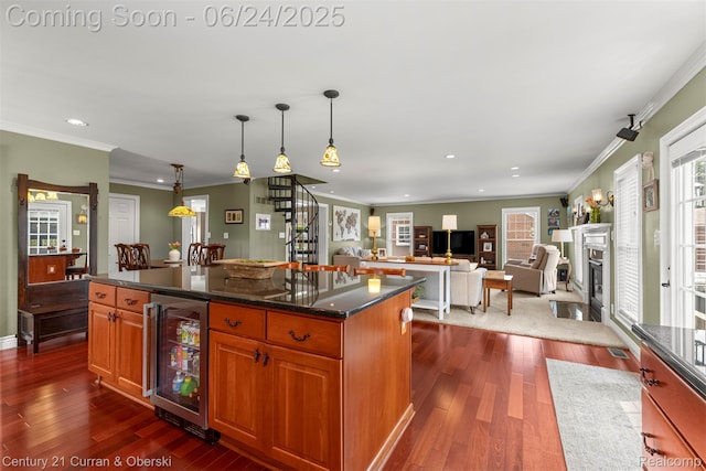 15275 Belmont Ave, Allen Park, MI 48101 - kitchen featuring beverage cooler, dark wood-type flooring, recessed lighting, hanging light fixtures, and a center island