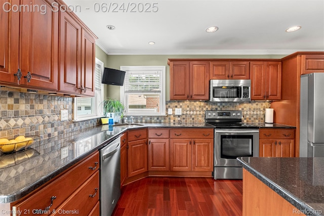 15275 Belmont Ave, Allen Park, MI 48101 - kitchen featuring appliances with stainless steel finishes, dark wood-style flooring, crown molding, decorative backsplash, and dark stone countertops