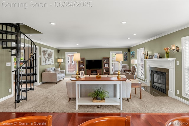 15275 Belmont Ave, Allen Park, MI 48101 - living area featuring a fireplace with flush hearth, crown molding, recessed lighting, stairway, and wood finished floors