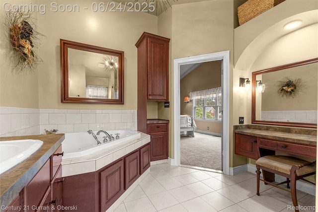 15275 Belmont Ave, Allen Park, MI 48101 - bathroom with a tub with jets, tile patterned flooring, and vanity