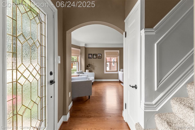 15275 Belmont Ave, Allen Park, MI 48101 - entrance foyer with arched walkways, wood finished floors, and stairs
