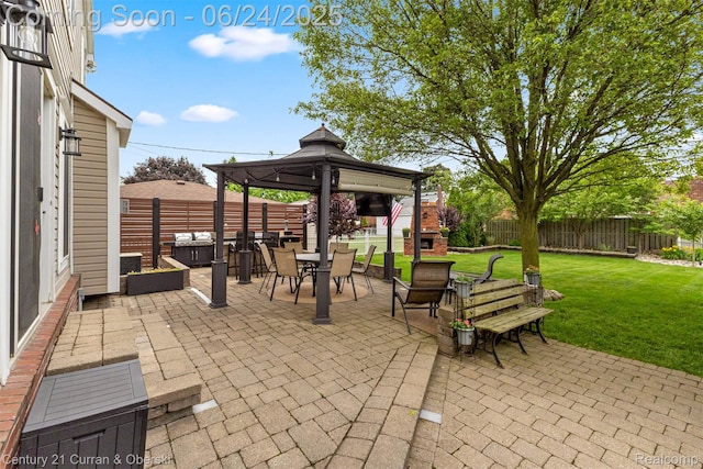 15275 Belmont Ave, Allen Park, MI 48101 - fenced backyard featuring a gazebo, a patio, and outdoor dining area