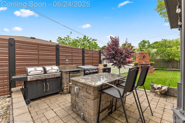 15275 Belmont Ave, Allen Park, MI 48101 - fenced backyard featuring a fireplace, area for grilling, and a patio
