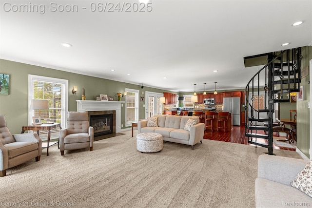 15275 Belmont Ave, Allen Park, MI 48101 - living room featuring recessed lighting, a tile fireplace, crown molding, and dark wood-type flooring