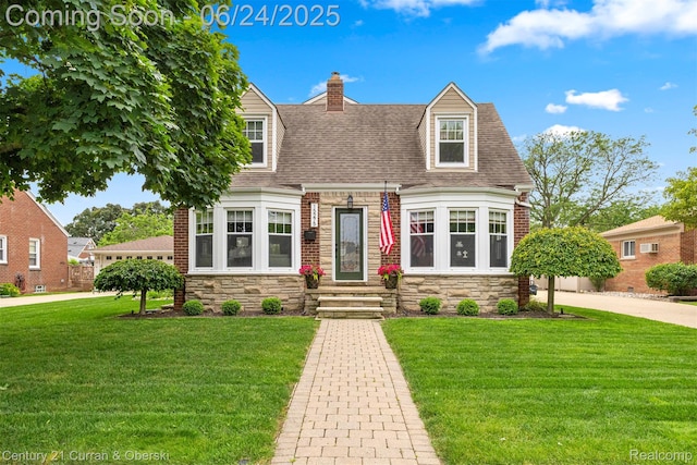 15275 Belmont Ave, Allen Park, MI 48101 - new england style home featuring stone siding, a front lawn, roof with shingles, and a chimney