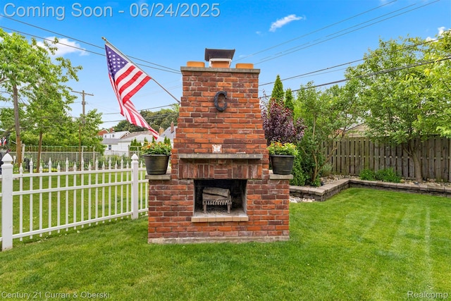 15275 Belmont Ave, Allen Park, MI 48101 - fenced backyard with an outdoor brick fireplace