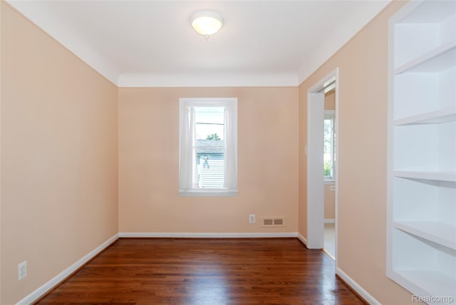 16555 Juliana Ave, Eastpointe, MI 48021 - unfurnished room featuring wood finished floors and built in shelves
