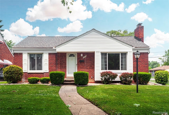 16555 Juliana Ave, Eastpointe, MI 48021 - bungalow-style home featuring brick siding, a front yard, roof with shingles, and a chimney
