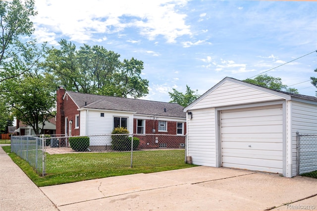 16555 Juliana Ave, Eastpointe, MI 48021 - ranch-style home featuring concrete driveway, an outbuilding, a detached garage, a chimney, and brick siding