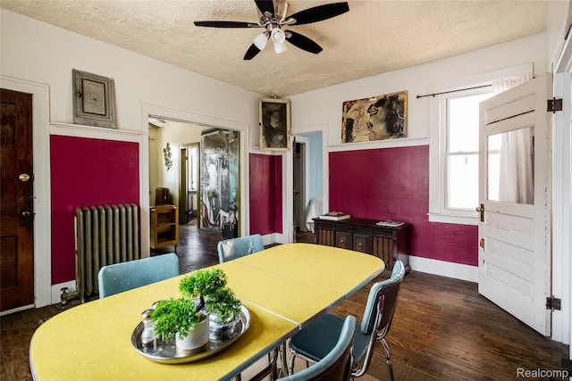 7824 Mount Elliott St, Detroit, MI 48211 - dining area featuring radiator heating unit, a textured ceiling, ceiling fan, and wood finished floors