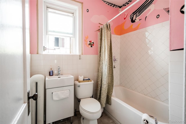 7824 Mount Elliott St, Detroit, MI 48211 - bathroom with tile walls, shower / bath combination with curtain, tile patterned flooring, vanity, and a wainscoted wall