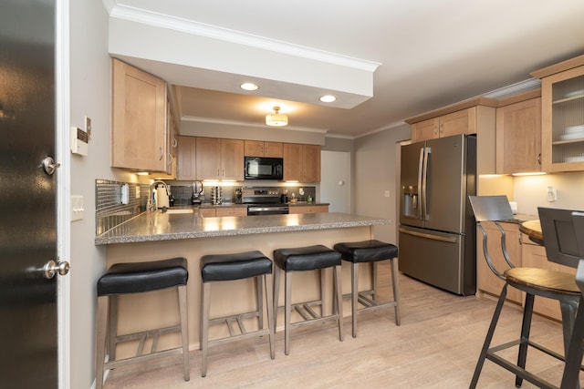 6615 Pleasantview Dr, Portage, MI 49024 - kitchen with appliances with stainless steel finishes, crown molding, a peninsula, backsplash, and light wood-style flooring