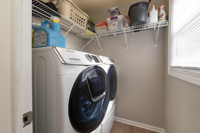 6615 Pleasantview Dr, Portage, MI 49024 - laundry area with washing machine and dryer and wood finished floors