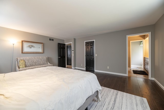 6615 Pleasantview Dr, Portage, MI 49024 - bedroom with dark wood finished floors and ensuite bathroom
