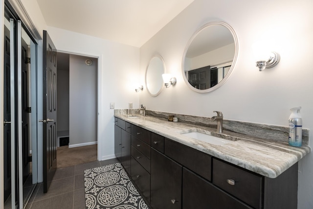 6615 Pleasantview Dr, Portage, MI 49024 - bathroom featuring double vanity and tile patterned floors