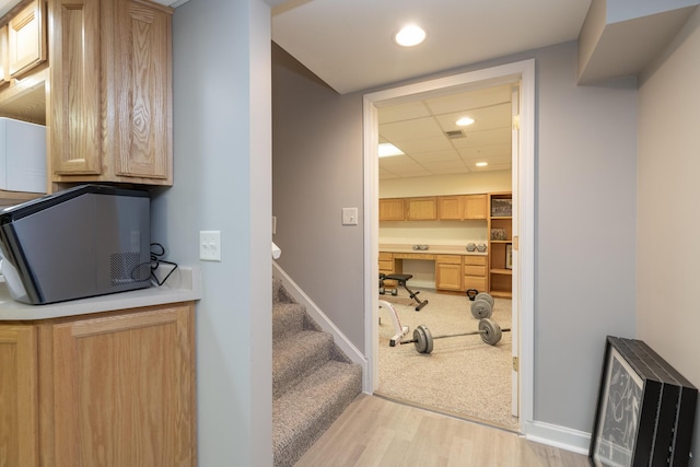 6615 Pleasantview Dr, Portage, MI 49024 - stairs with wood finished floors, recessed lighting, and built in desk